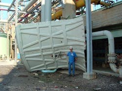 A storm blew down the fan housing of a cooling tower. A storm blew down the fan housing of a cooling tower.
