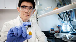 Photo-1-NTU-SPMS-Asst-Prof-Soo-Han-Sen-with-the-plastic-photocatalyst-mixture