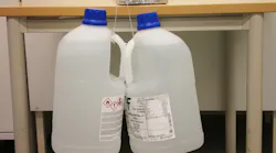 Impressive Adhesion Figure 2. Material held two pieces of steel together strongly enough to suspend two jugs weighing a total of 16 kg for over a month.