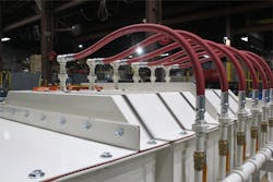 Figure 3. This pugmill mixer features a spray system consisting of multiple ports.