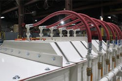 Figure 3. This pugmill mixer features a spray system consisting of multiple ports. Figure 3. This pugmill mixer features a spray system consisting of multiple ports.