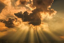 Rays of light shining through clouds