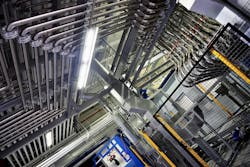 This ceiling shot of Akzo Nobel's Columbus, Ohio, manufacturing facility shows pipes above the mixing vessel delivering raw materials from a tank farm. The company produces packaging coatings at this site. Close collaboration with suppliers is necessary to ensure they can deliver on any formulation changes or new market demands, says Nate Norris, the company's North American manufacturing and supply chain director. This ceiling shot of Akzo Nobel's Columbus, Ohio, manufacturing facility shows pipes above the mixing vessel delivering raw materials from a tank farm. The company produces packaging coatings at this site. Close collaboration with suppliers is necessary to ensure they can deliver on any formulation changes or new market demands, says Nate Norris, the company's North American manufacturing and supply chain director.