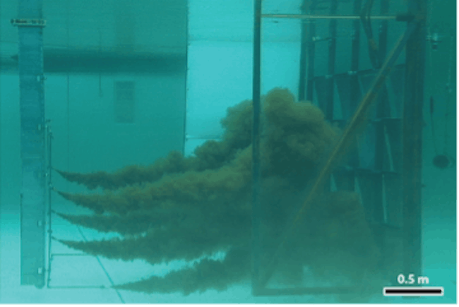 Figure 3: Pilot scale test of Oleo Sponge sorbent. An underwater plume of crude oil droplets encounters a wall of Oleo Sponge in a salt water tank at the Ohmsett facility.