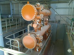 Examples of shell and tube heat exchangers with their nozzles during construction.