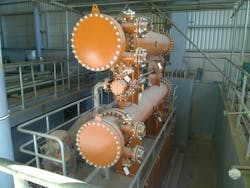 Figure 1. Example of shell and tube heat exchangers with their nozzles during construction. Figure 1. Example of shell and tube heat exchangers with their nozzles during construction.