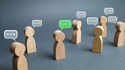 wooden people cutouts with speech bubbles above their heads