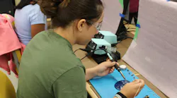 STEM camper doing soldering project