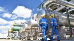 workers in an industrial plant for the production and processing of crude oil