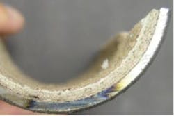 Figure 2. Layered calcium carbonate (CaCO3) deposits in a boiler tube from chronic softener upsets. (2) Figure 2. Layered calcium carbonate (CaCO3) deposits in a boiler tube from chronic softener upsets. (2)