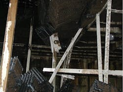 Figure 4. Cooling tower fill and support beams that have collapsed into the tower basin from excessive loading. Photo courtesy of Rich Aull, Richard Aull Cooling Tower Consulting, LLC. Figure 4. Cooling tower fill and support beams that have collapsed into the tower basin from excessive loading. Photo courtesy of Rich Aull, Richard Aull Cooling Tower Consulting, LLC.