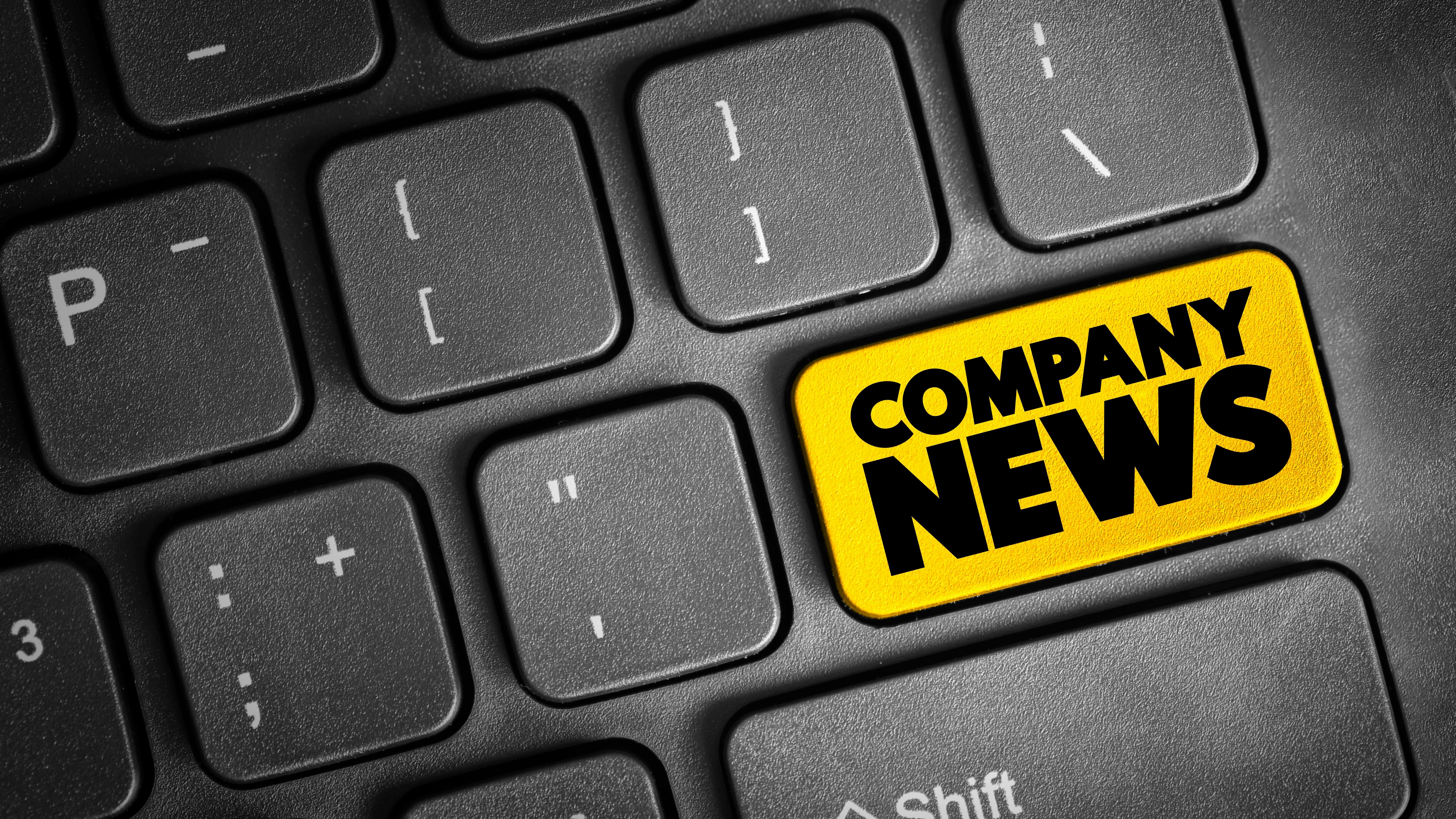 Keyboard with a Yellow Enter Key labeled as Company News