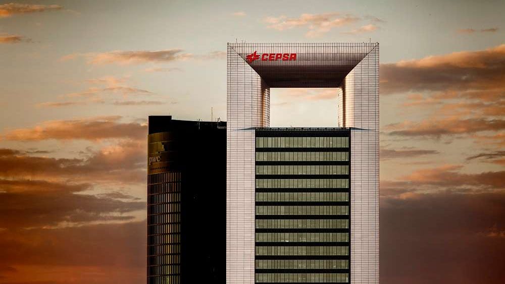 cepsa headquarters building agains orange skyline