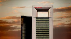 cepsa headquarters building agains orange skyline