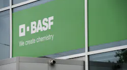BASF logo and we create chemistry slogan on green background at its Lugwigshafen headquarters