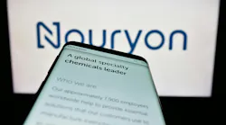 Mobile phone with website of Nouryon Chemicals on screen in front of Nouryon business logo