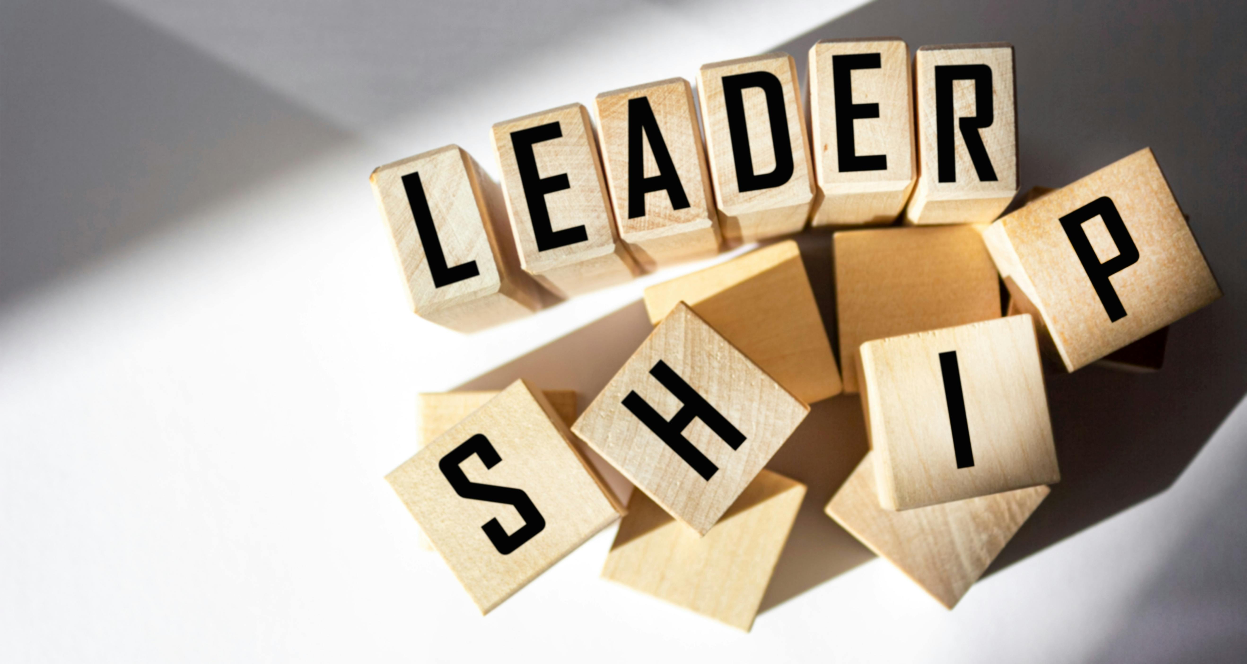 wooden blocks displaying letters that spell leadership