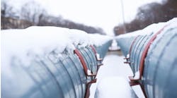 Winter landscape with the snow-covered gas pipeline and trees Winter landscape with the snow-covered gas pipeline and trees
