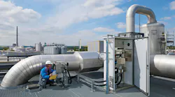 engineer using gas analysis and flow measurement technology