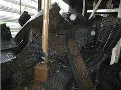 Total fill support collapsed from the weight of microbiological fouling accumulations. Total fill support collapsed from the weight of microbiological fouling accumulations.