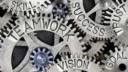 Words Teamwork, Vision, Goal, Trust, Success, Skill, Partner displayed on gears Words Teamwork, Vision, Goal, Trust, Success, Skill, Partner displayed on gears