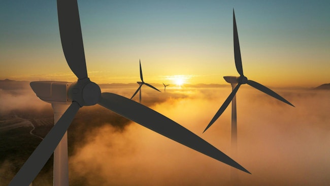 Wind turbine silhouette at sunrise
