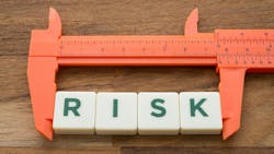 ruler measuring tile blocks with letters spelling out risk ruler measuring tile blocks with letters spelling out risk