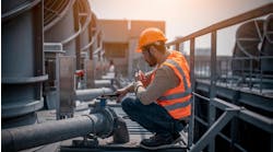 Industry engineer under checking the industry cooling tower air conditioner is water cooling tower air chiller HVAC of large industrial building to control air system. Industry engineer under checking the industry cooling tower air conditioner is water cooling tower air chiller HVAC of large industrial building to control air system.