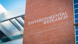 Tall brick building featuring 'ENVIRONMENTAL RESEARCH' sign. Tall brick building featuring 'ENVIRONMENTAL RESEARCH' sign.