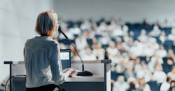 Female speaker giving a talk on corporate business conference. Female speaker giving a talk on corporate business conference.