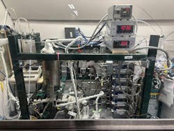 The experimental set up included mass flow controllers, a furnace to heat the reactor, a recirculating pump to move the gases around, a gas chromatograph (GC) to monitor gas composition, and process lines to route the gases around between the reactor, pump, and GC. The experimental set up included mass flow controllers, a furnace to heat the reactor, a recirculating pump to move the gases around, a gas chromatograph (GC) to monitor gas composition, and process lines to route the gases around between the reactor, pump, and GC.