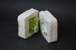 The white mycelium grows on the outside of the glass, which turns coffee grounds into a compostable alternative to Styrofoam. The white mycelium grows on the outside of the glass, which turns coffee grounds into a compostable alternative to Styrofoam.