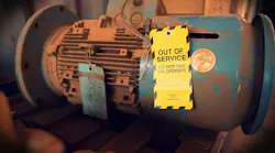Safety workplaces yellow out of service tag attached on faulty damage defect of electric power motor.