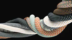 braided synthetic cables with textile coating on black background
