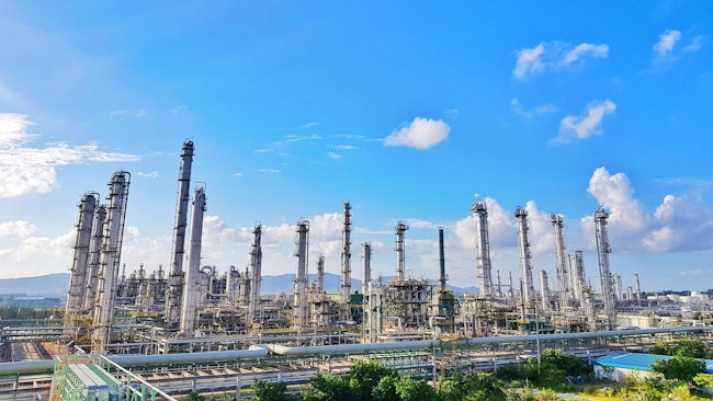 Tower refinery of chemical plant for thermal gas naphtha propylene and ethylene cracker with beautiful blue sky