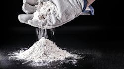 gloved hand cups white powder dropping it into a pile gloved hand cups white powder dropping it into a pile