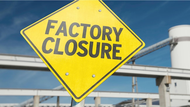 A sign with the word 'FACTORY CLOSURE'