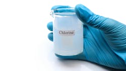 chlorine solution in glass jar chlorine solution in glass jar