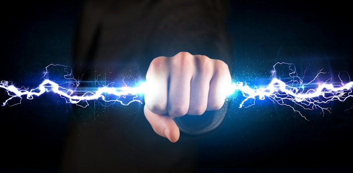 static electricity lightning bolt running through closed hand