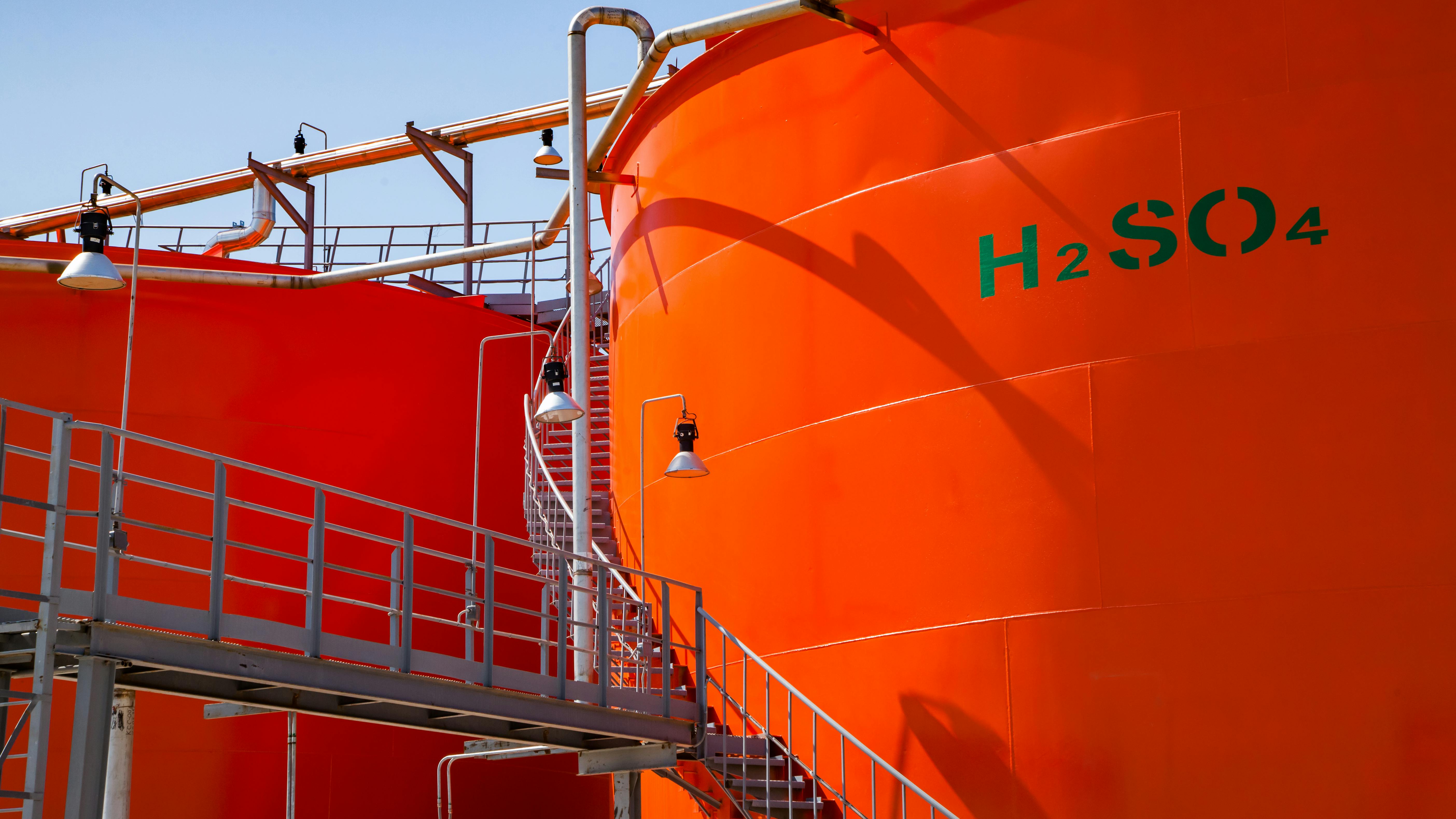 orange industrial Sulfuric Acid tanks