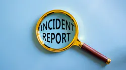 magnifying glass over the words incident report on blue background