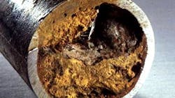 Severe iron oxide deposition in a carbon steel pipe. Severe iron oxide deposition in a carbon steel pipe.