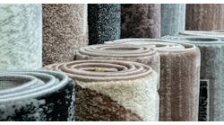 Variety of carpets rolled up Variety of carpets rolled up