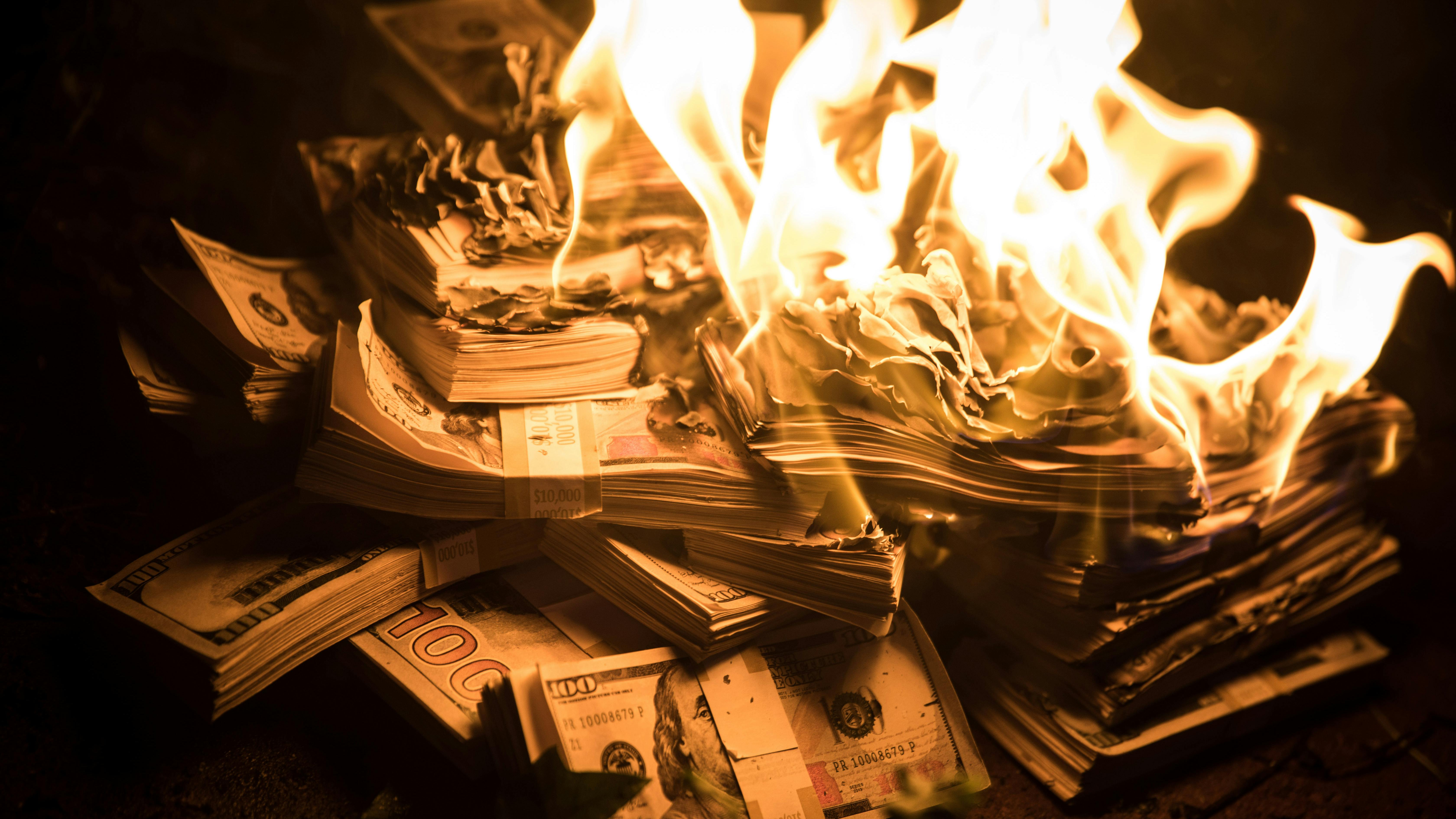 Pile of money burning
