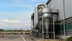 Air pollution control equipment as dust cyclone collection and chimney stack locates out of industrial building. Air pollution control equipment as dust cyclone collection and chimney stack locates out of industrial building.