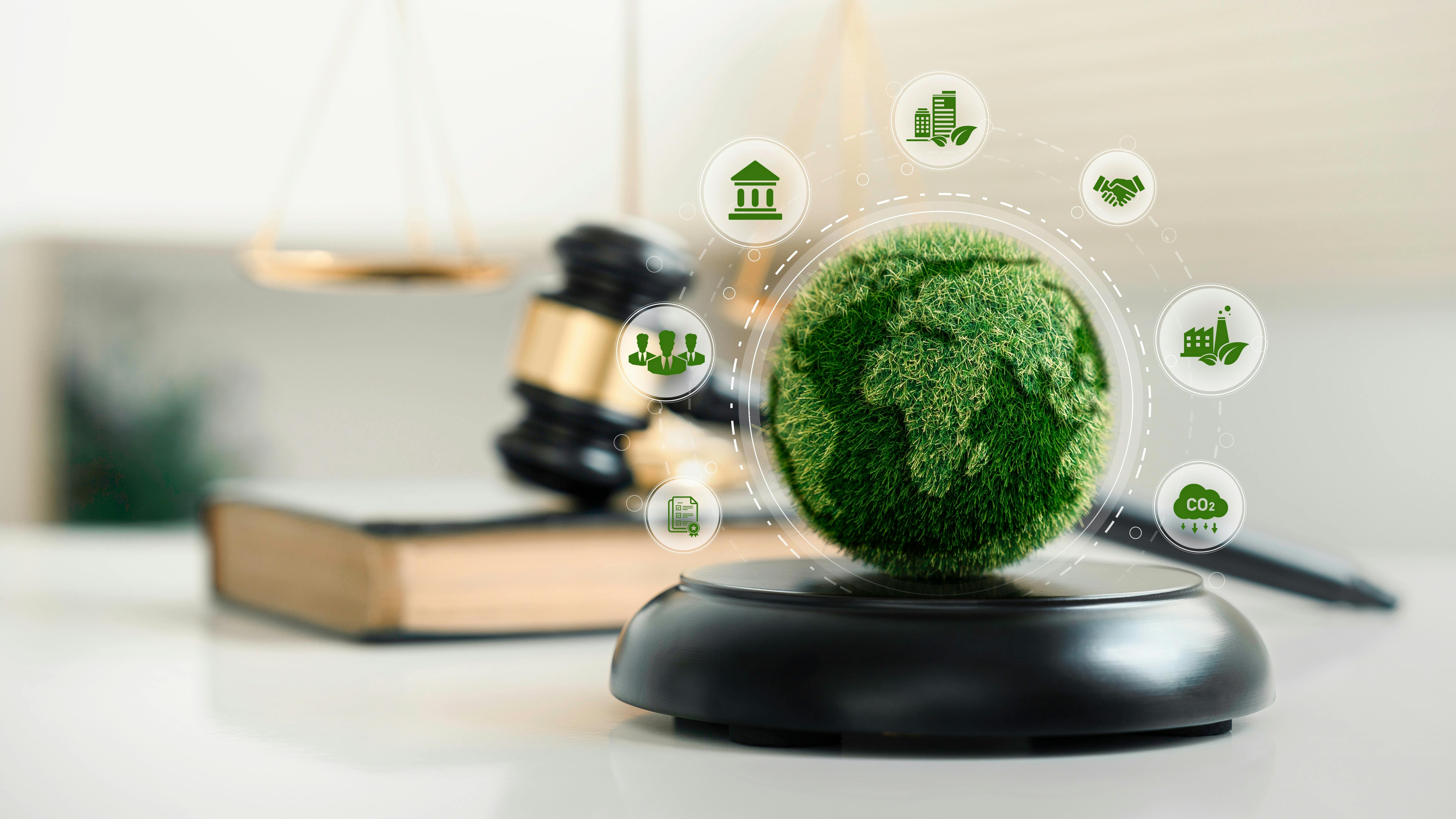 world and wooden gavel with a golden scale for law international environmental concept of business corporate and industry.