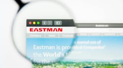 Magnifying glass hovers over Eastman logo on computer screen Magnifying glass hovers over Eastman logo on computer screen
