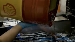 Shell's immersion cooling fluid is poured into the workstation setup in Hillsboro, Oregon, where extensive certification testing was conducted with 5th Gen Intel Xeon processors. Shell's immersion cooling fluid is poured into the workstation setup in Hillsboro, Oregon, where extensive certification testing was conducted with 5th Gen Intel Xeon processors.