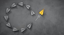 paper airplanes form a circle shape with one flying away from it paper airplanes form a circle shape with one flying away from it