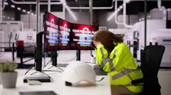 An operator stressing over a cyber attack at an industrial facility